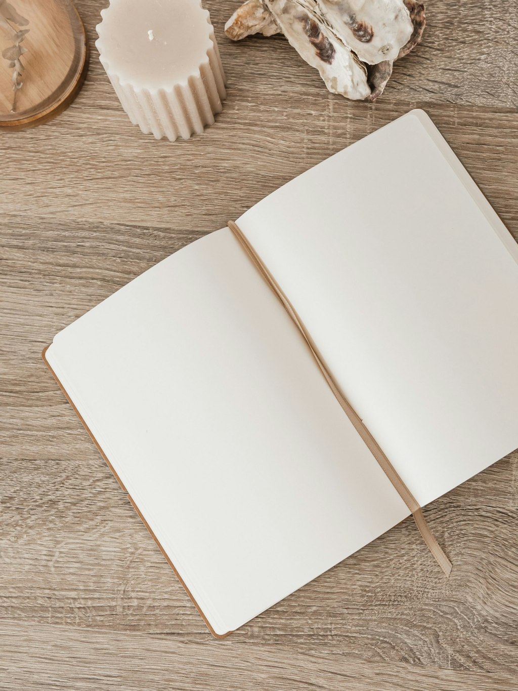 How to start a grimoire: an open notebook on a wooden table