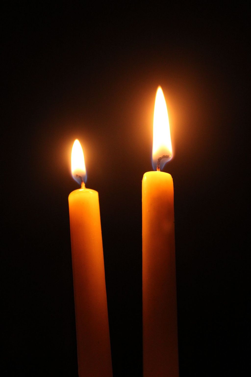 Mercury and Venus station direct November 2026: two candle flames glowing in the dark